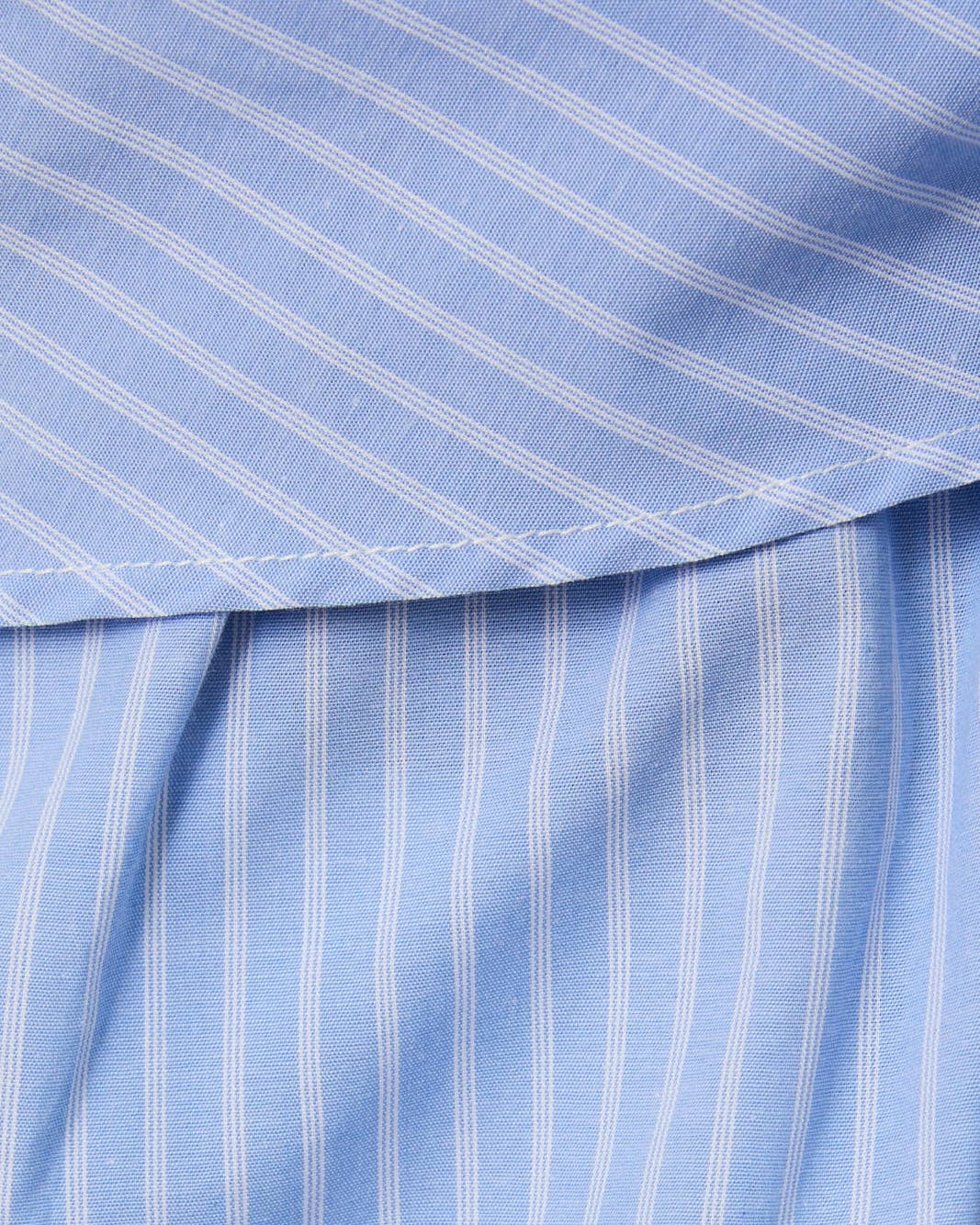 Close-up of blue fabric with white stripes