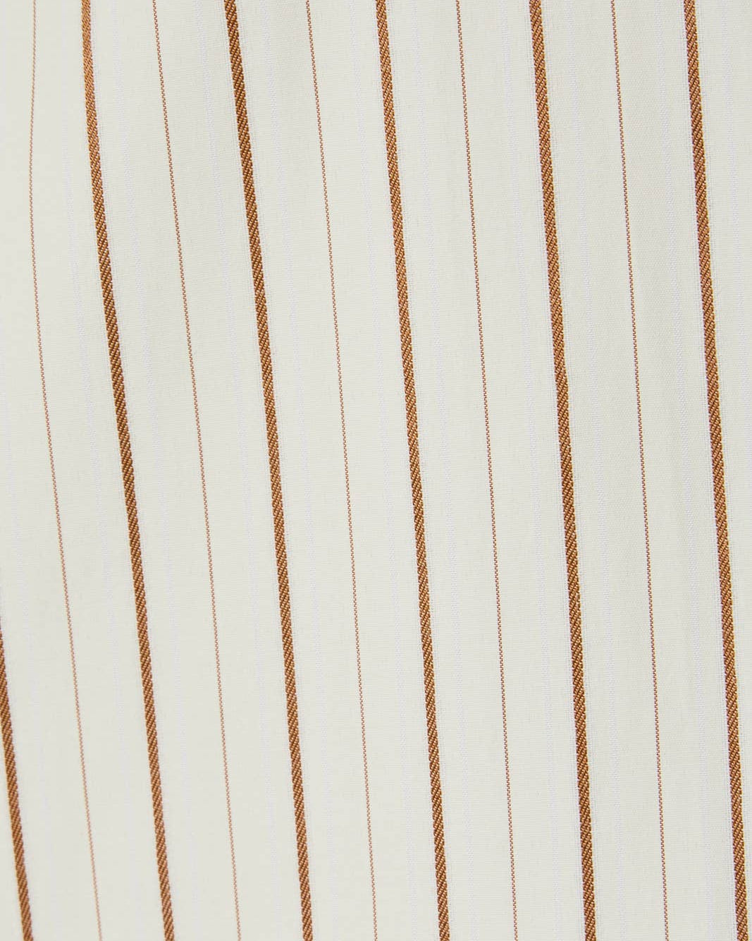 Close-up of fabric with brown vertical stripes on a white background