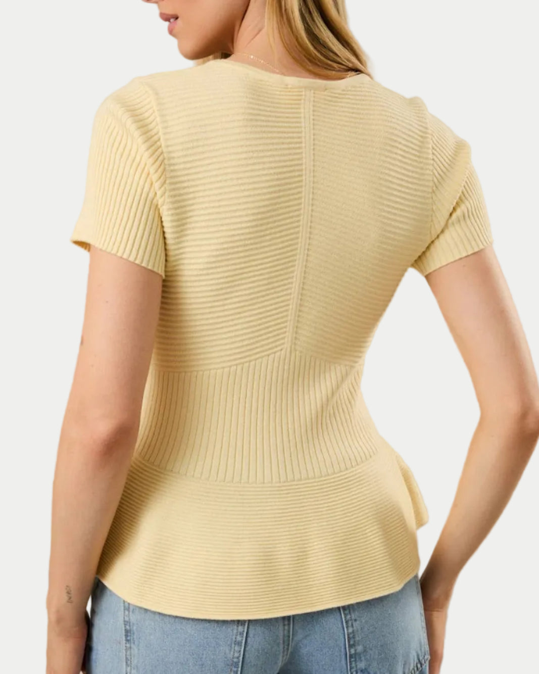 ROUND NECK SHORT SLEEVE PEPLUM RIBBED TOP IN BUTTER YELLOW ON A MODEL BACK VIEW- Blackbird Boutique