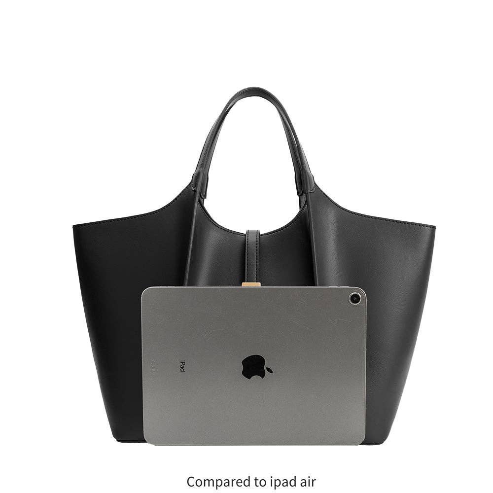 Black handbag with an iPad Air, on a white background.