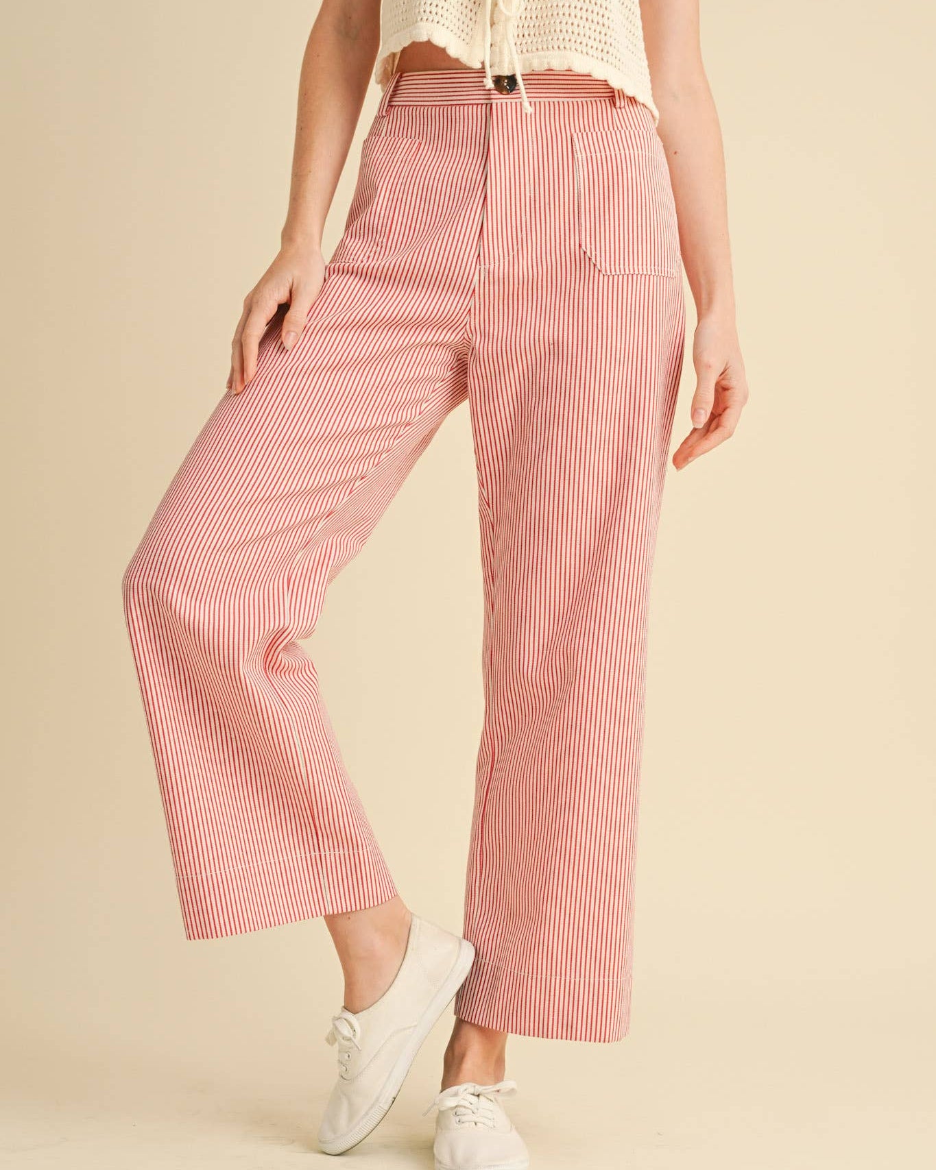 High waist cropped pants with white background and red pinstripes. Front View