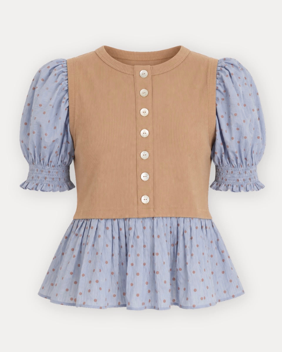 A children's long-sleeve top with a tan ribbed vest-style bodice and light blue patterned puff sleeves and skirt, shown on a plain light background.