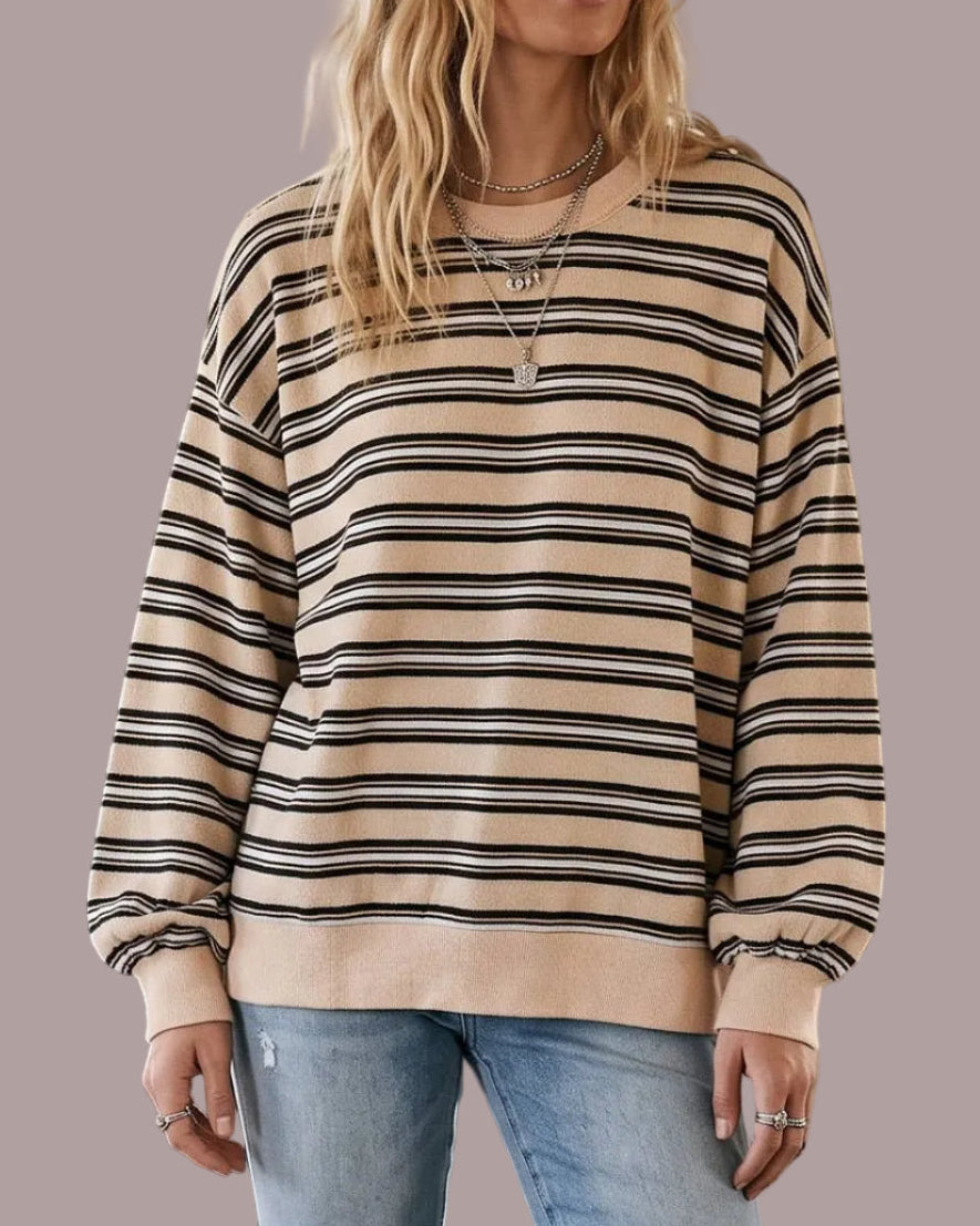 Model wearing a french terry striped sweatshirt in beige combo. neutral background