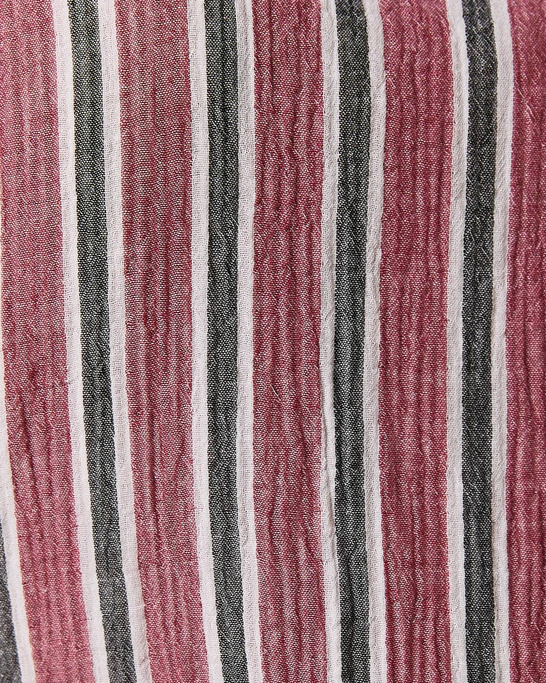 A close-up of a vertically striped fabric with alternating stripes of burgundy, charcoal gray, and off-white.
