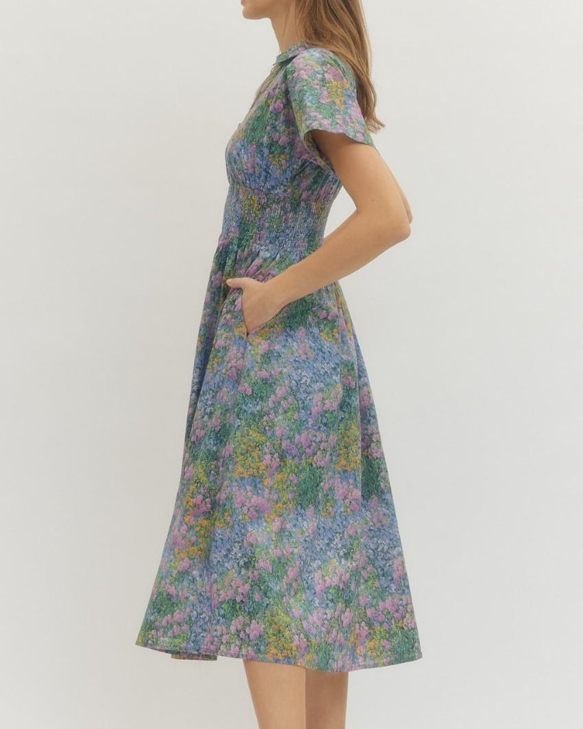 Woman wearing a floral dress on a white background