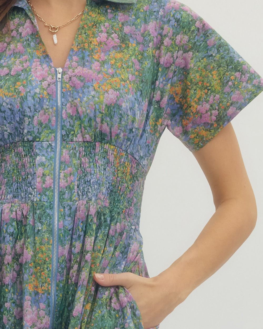 Woman wearing a floral dress with a white background