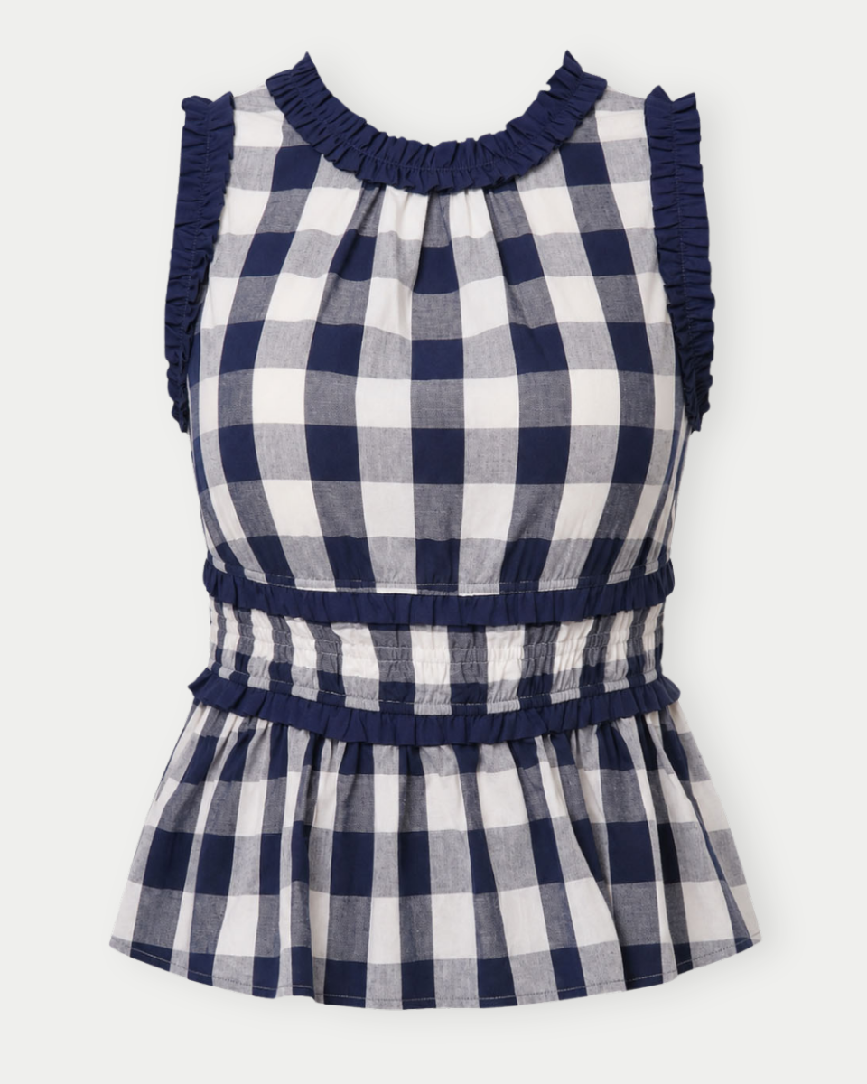 Navy and white checkered dress with ruffled neckline on a white background