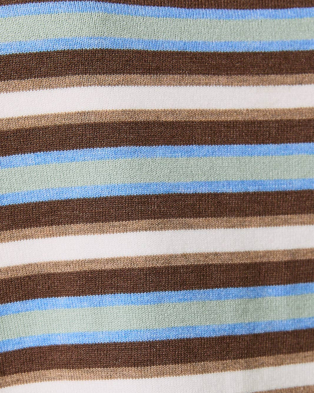 Close-up of a fabric with brown, blue, sage and white stripes.