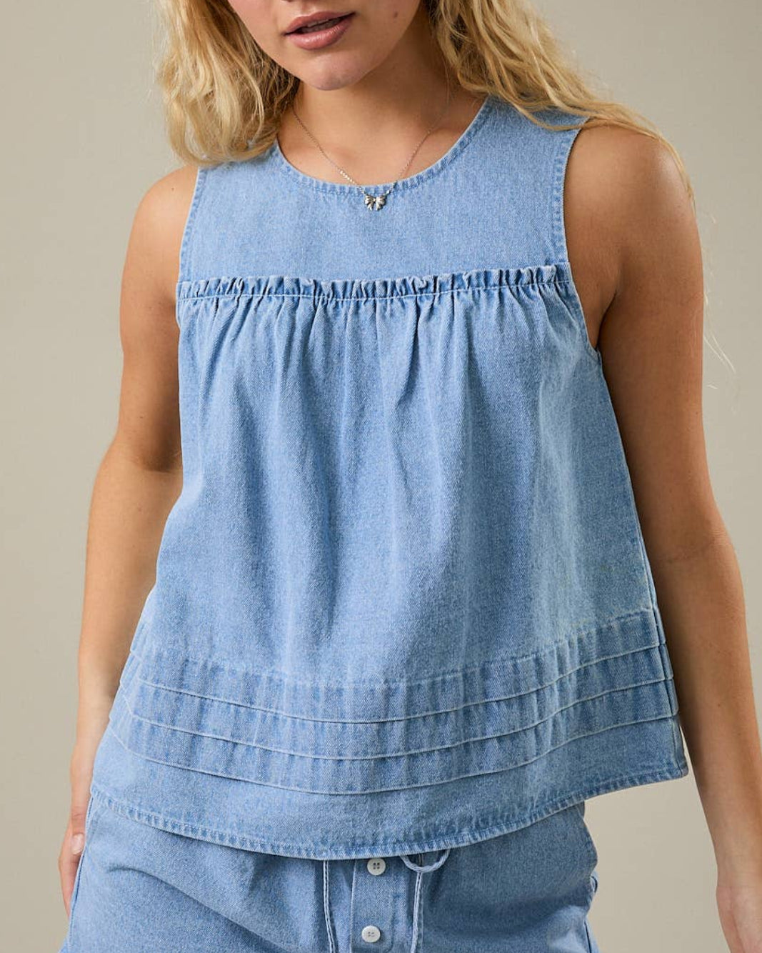 Denim Darling Swing Tank Top on a model with a neutra background- Blackbird Boutique