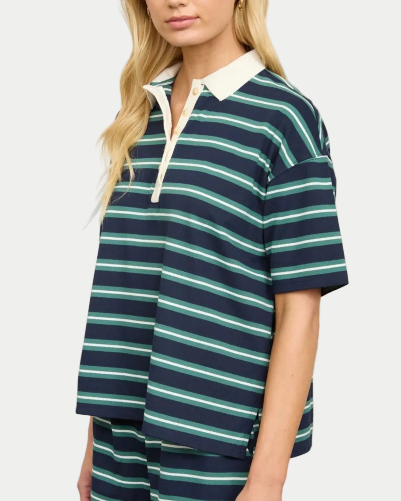 Model wearing a navy/green striped polo shirt on a neutral background. Part of a set. Side view