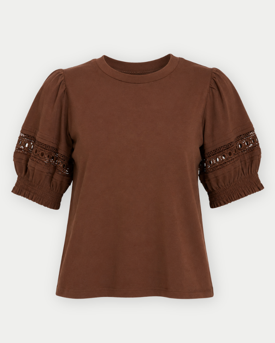 A brown short-sleeve top with puffed sleeves and lace-up cuffs, shown against a light gray background.