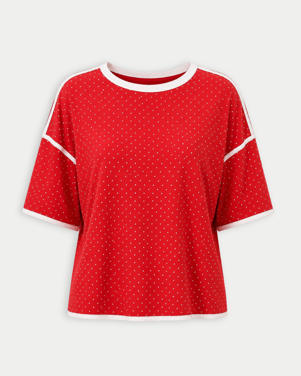 Red polka dot shirt with white trim on a light gray background