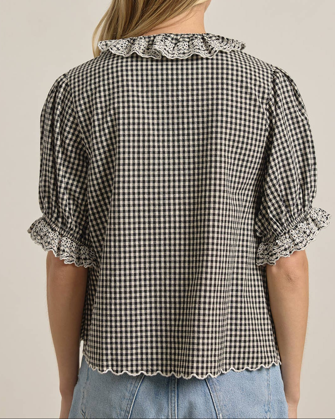 Gingham Lace Ruffle Blouse on a model with a neutral background back view