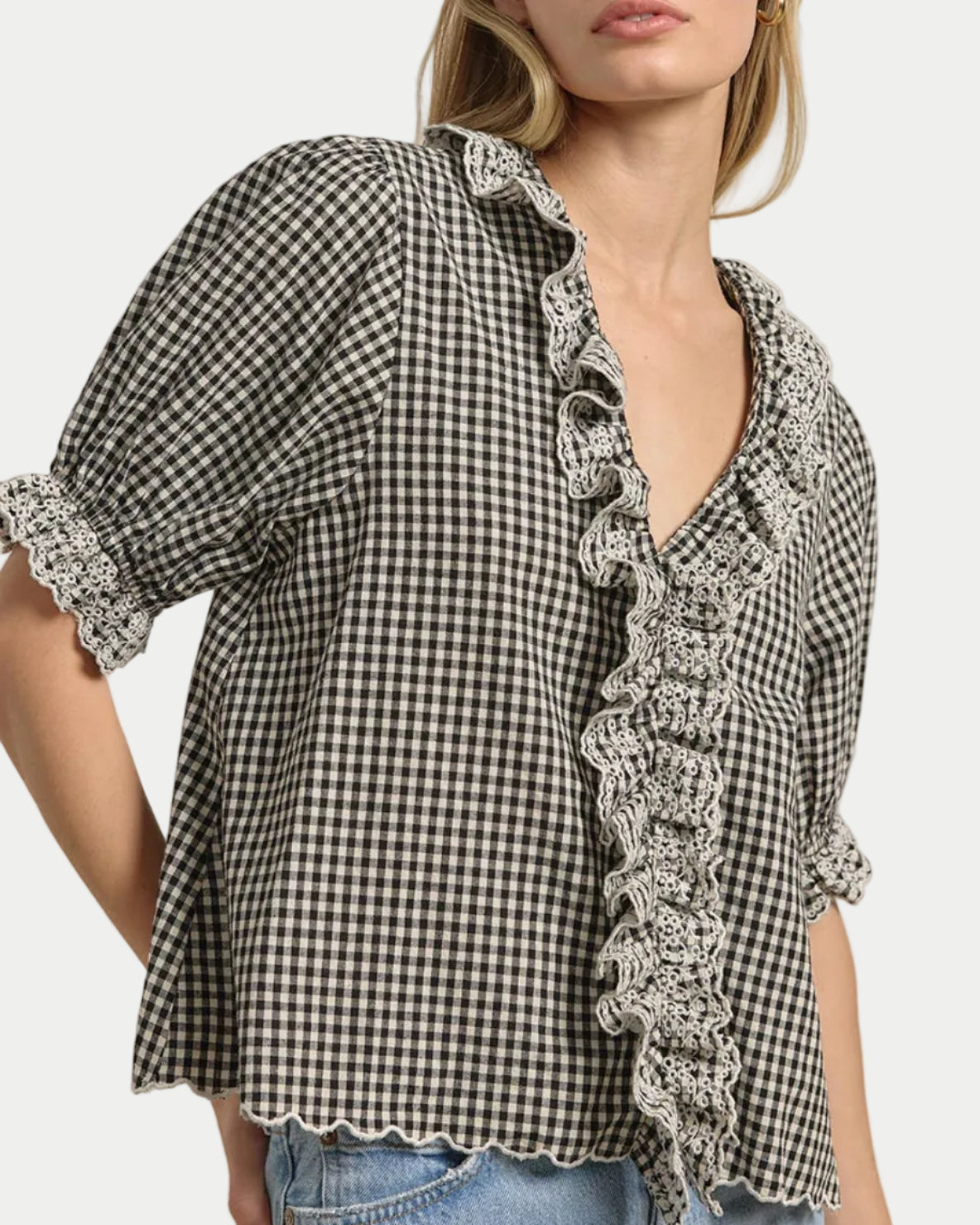 Gingham Lace Ruffle Blouse on a model with a neutral background side view