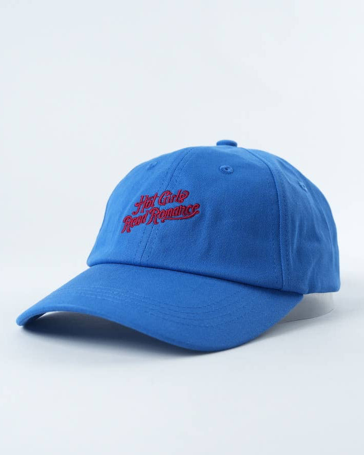 Blue cap with red text on a light gray background