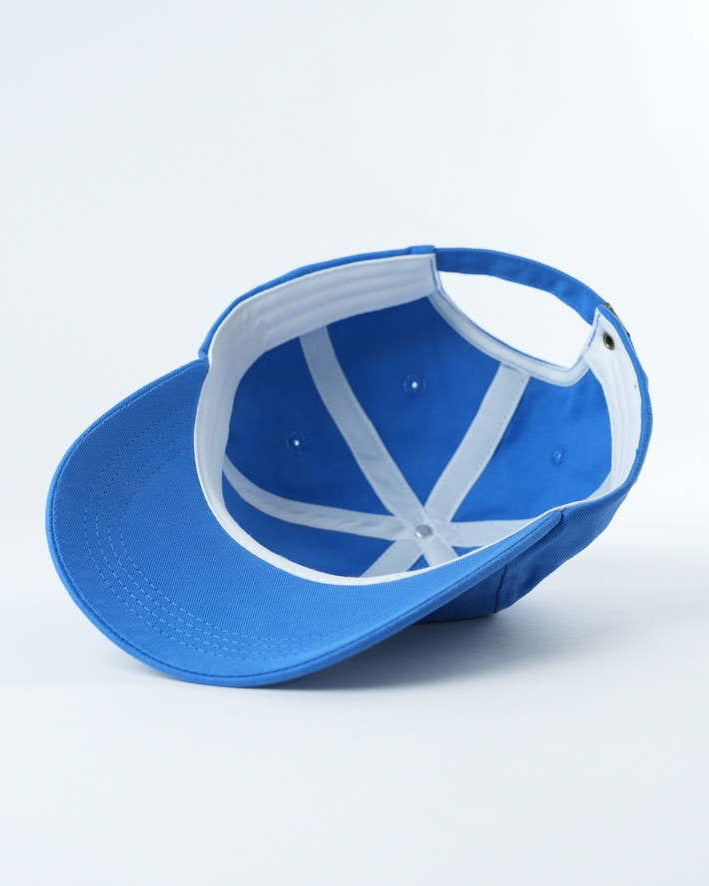 Blue cap with white interior on a light gray background