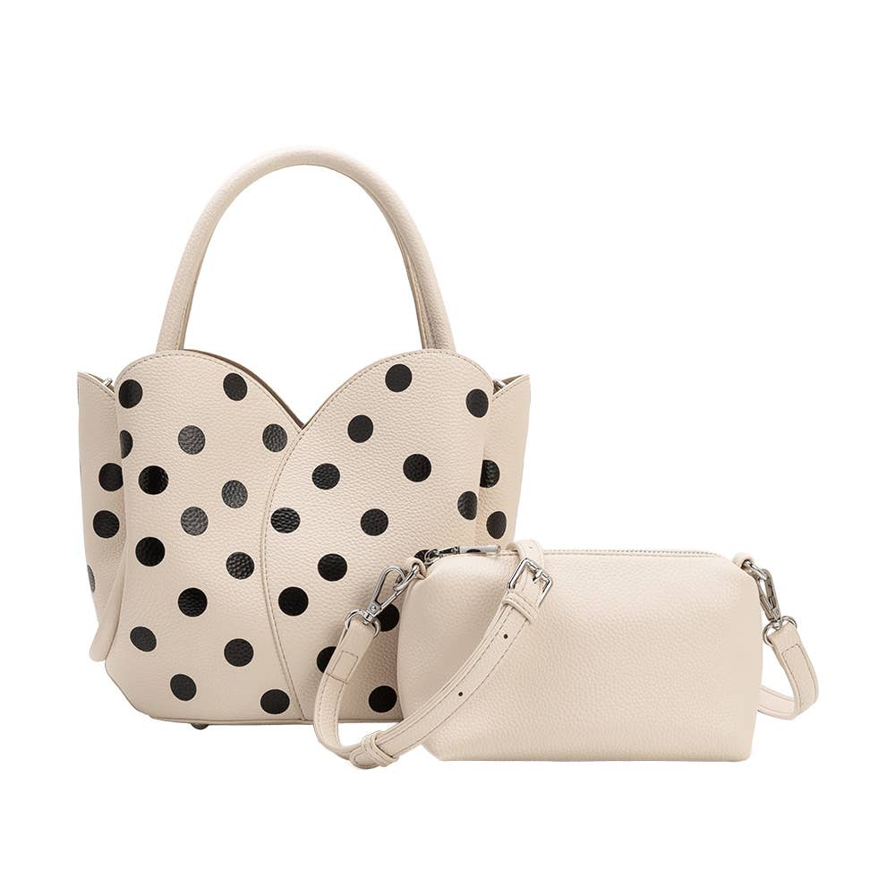 Beige handbag with black polka dots and matching pouch on a white background