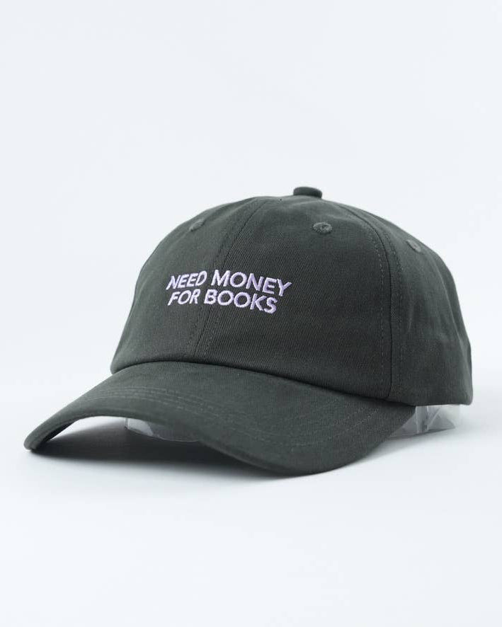 Black cap with 'NEED MONEY FOR BOOKS' text on a white background