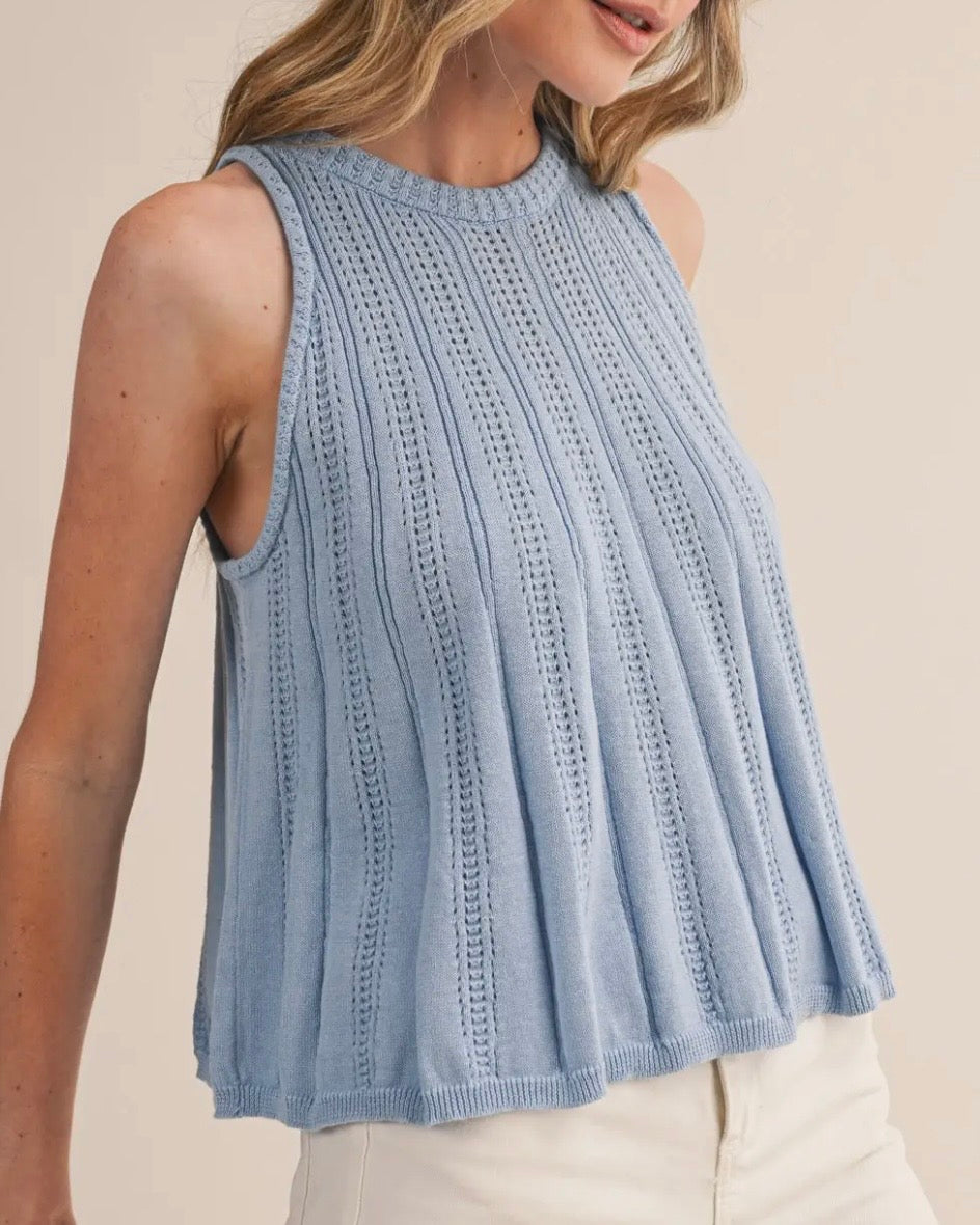 Sleeveless Sweater Tank in Blue - on a model with a neutral background - Blackbird Boutique - side view
