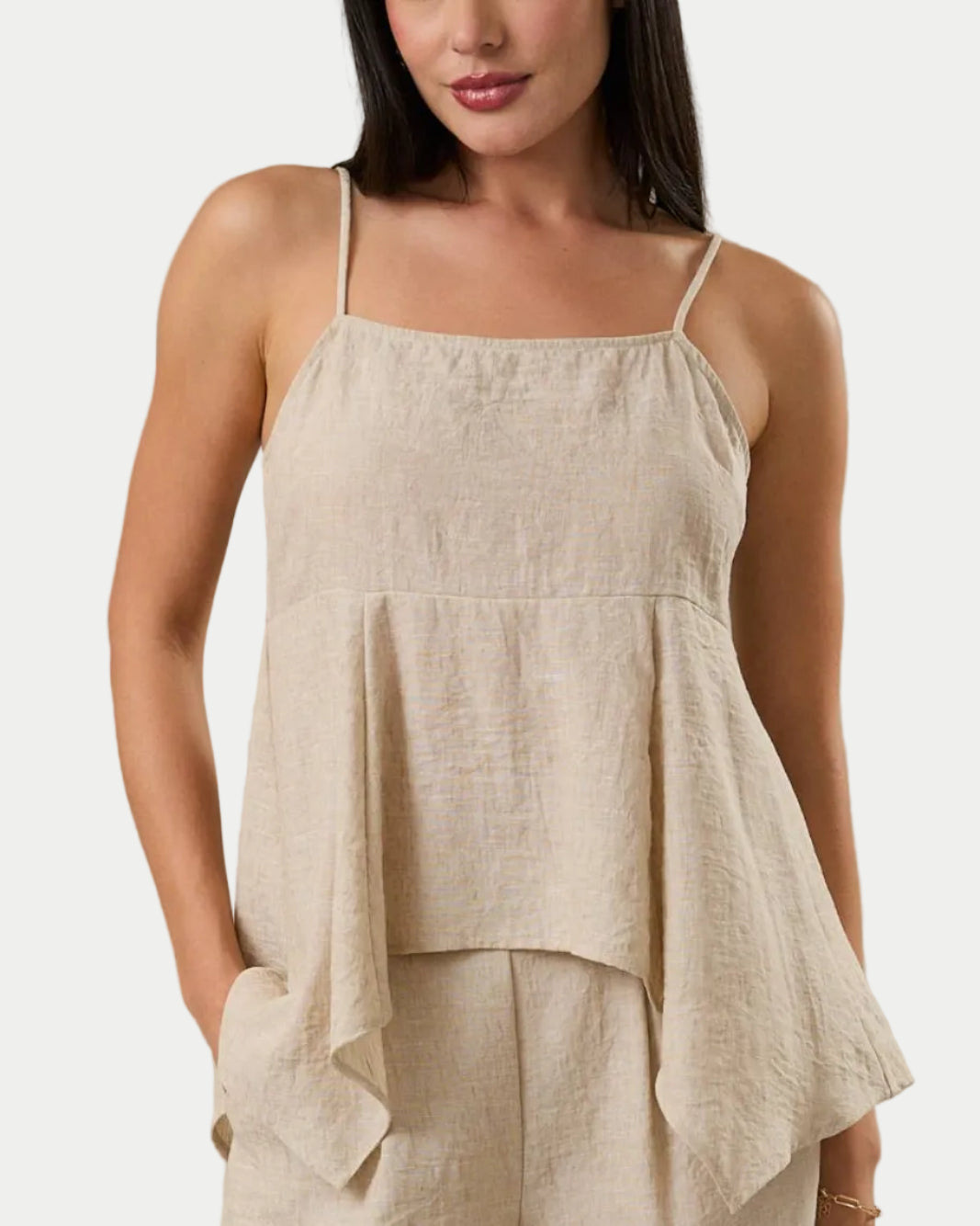 SLEEVELESS BACK SMOCKING HANKY HEM TOP. front view on a model with a neutral background. Summer ready style for parties, graduation guests, date night and brunch - Blackbird Boutique