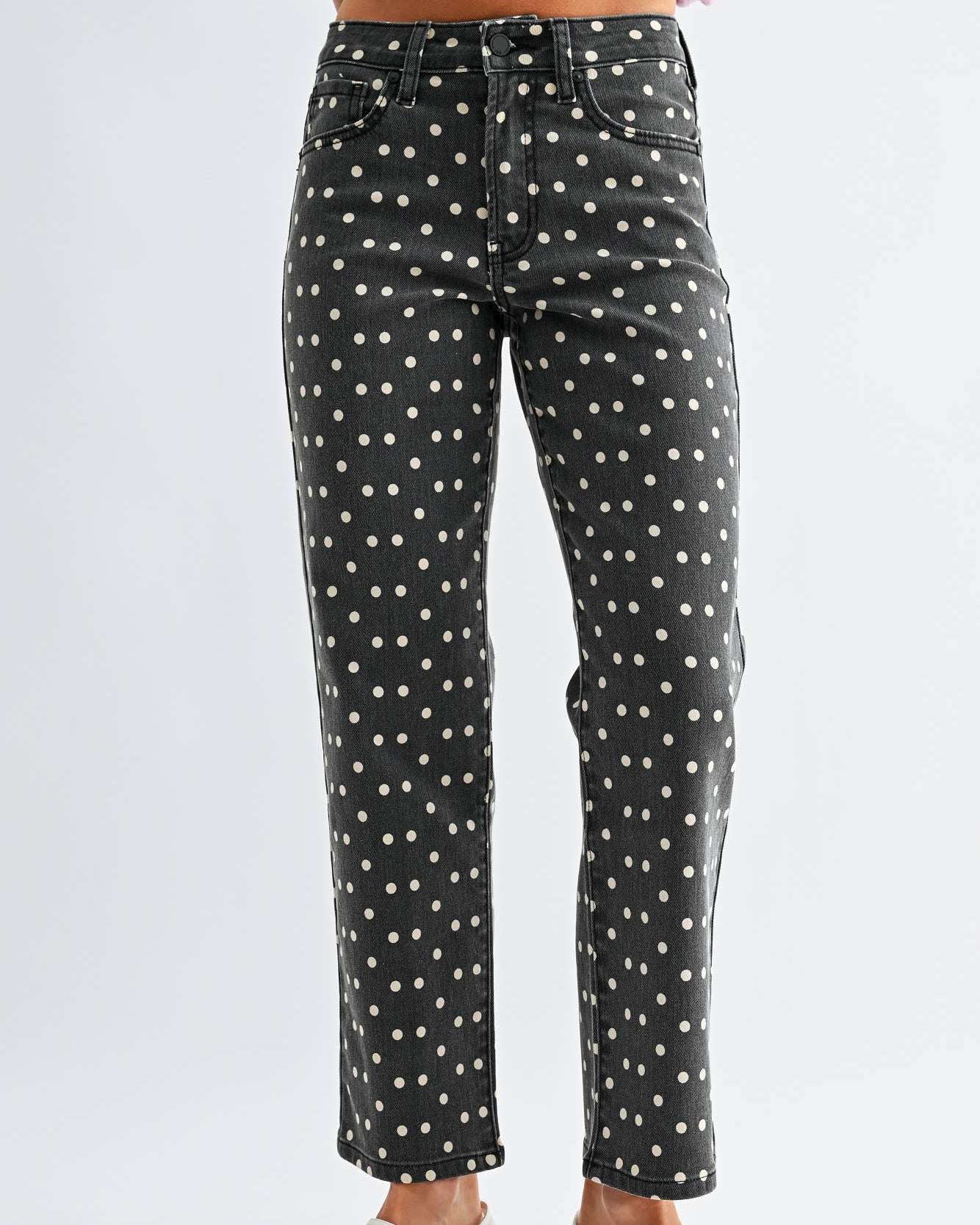 Vintage Black jeans with white polka dots worn by a model on a neutral background