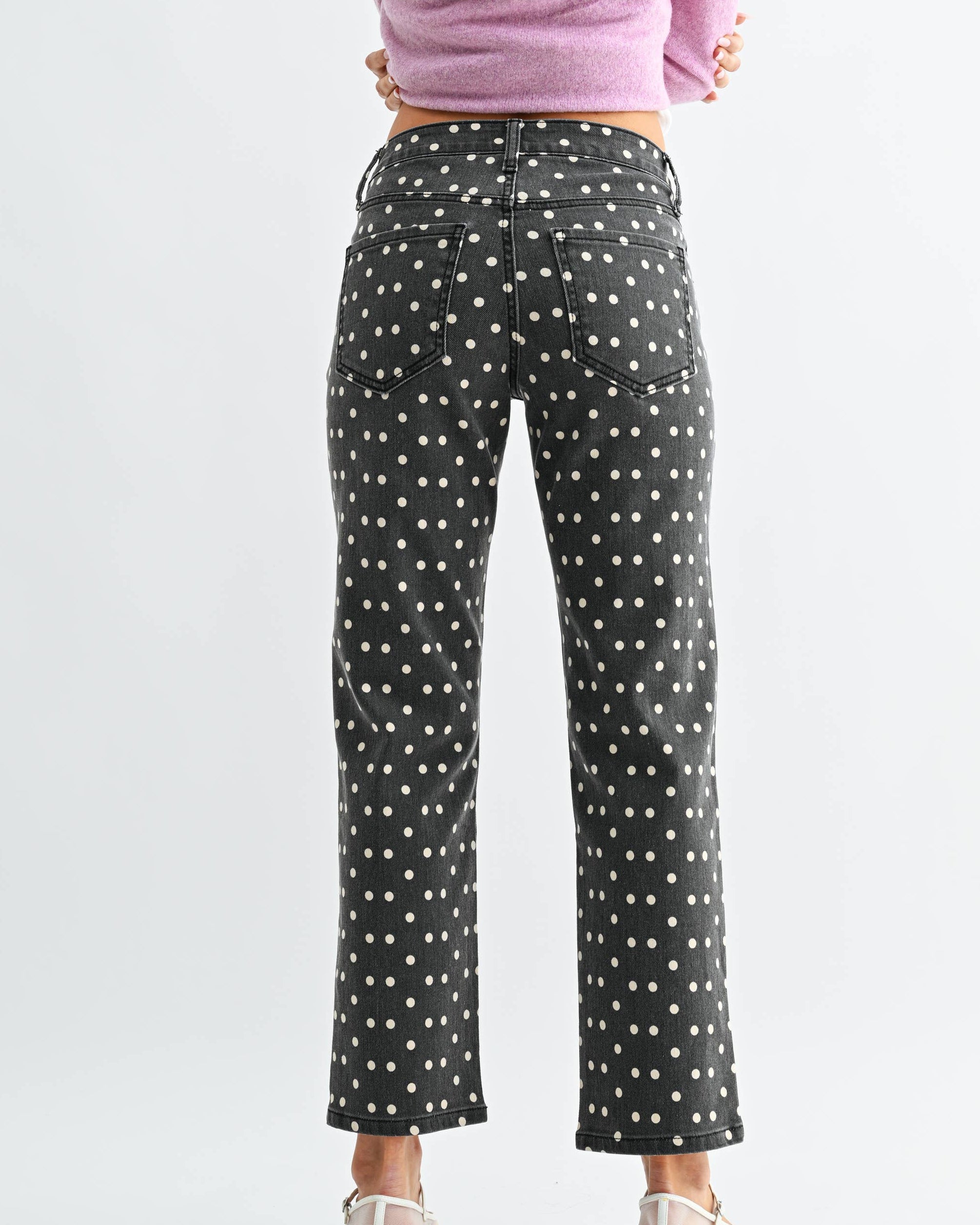 Vintage Black jeans with white polka dots worn by a model on a neutral background back view