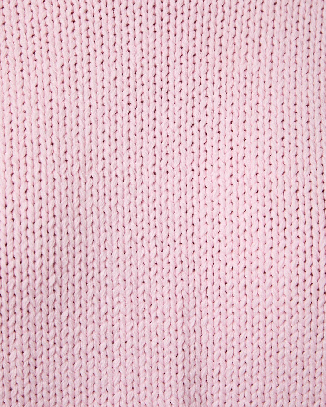 Close-up of pink knitted fabric texture