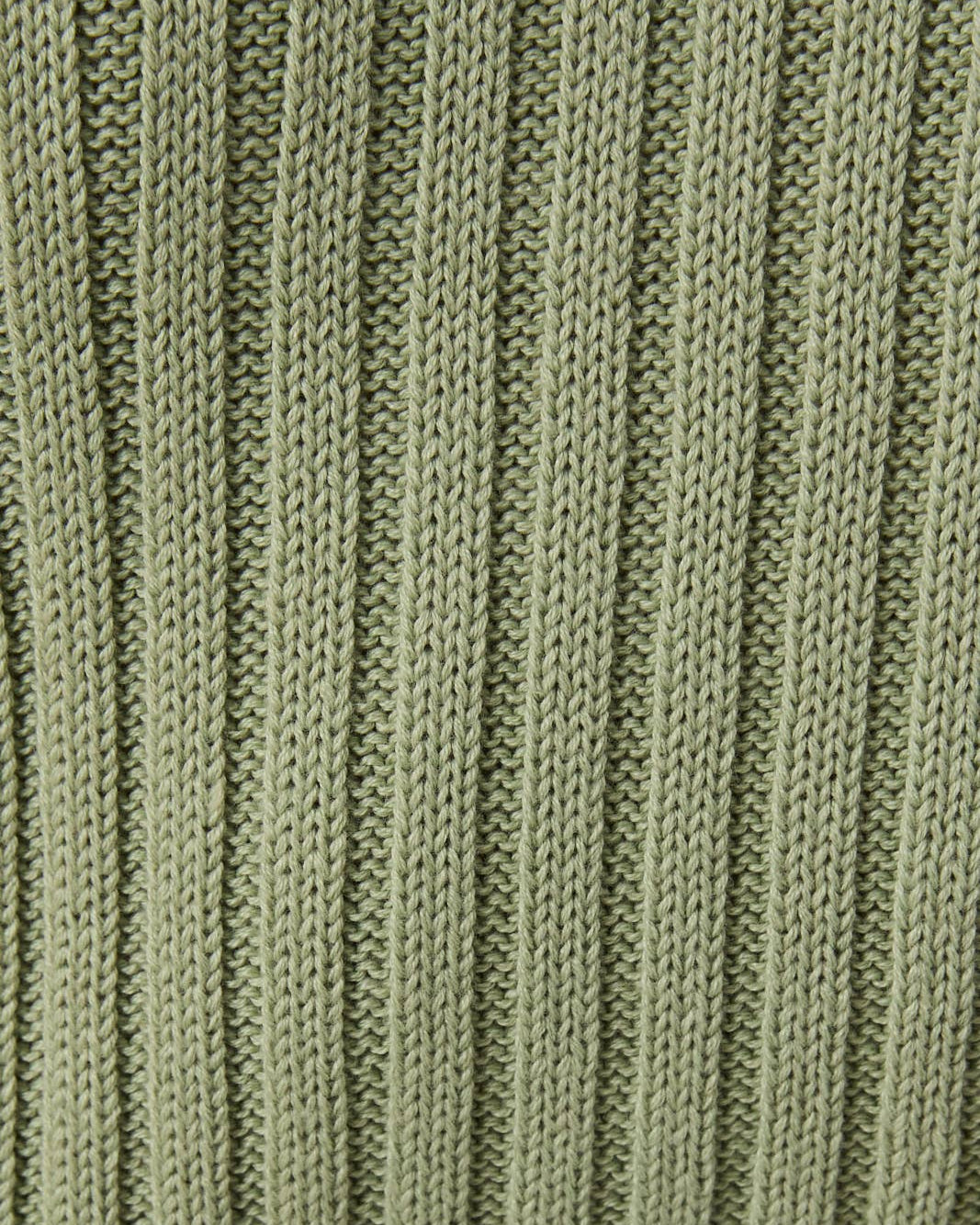Close-up of a green knitted fabric texture