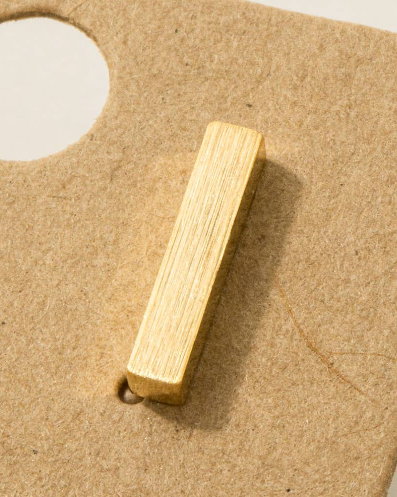 Wooden block on a cardboard background