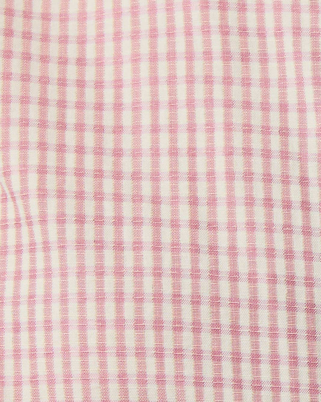Close-up of pink and white checkered fabric texture