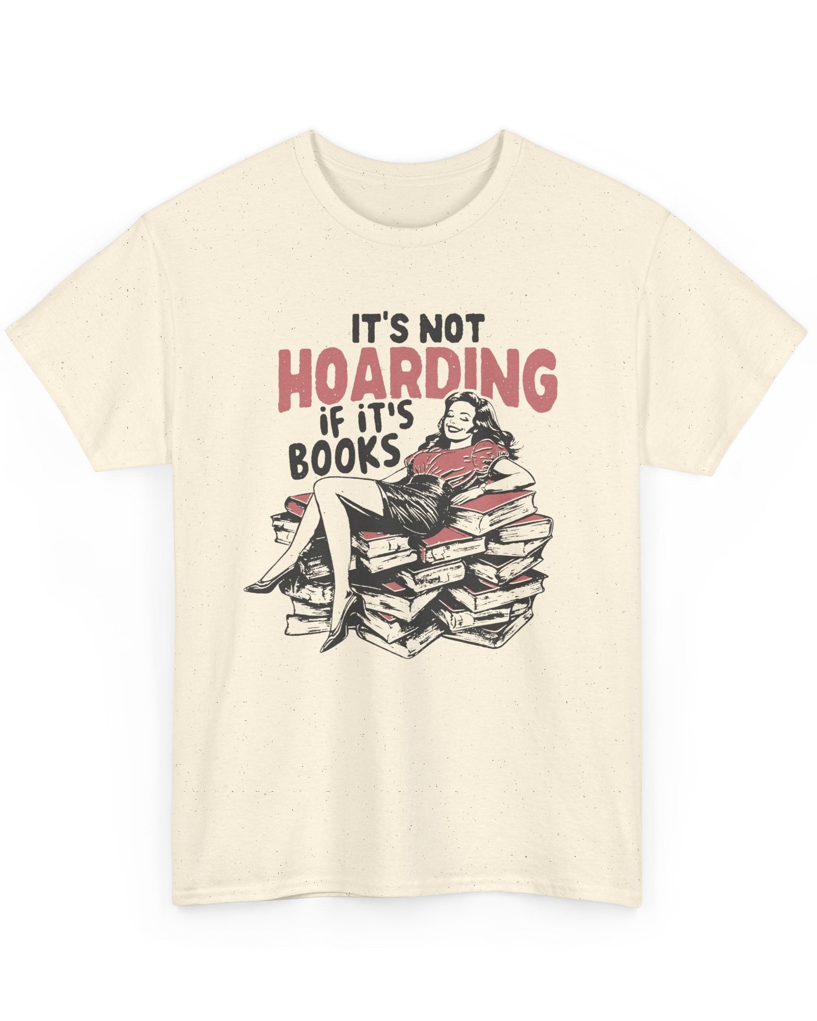 Beige t-shirt with a graphic of a person sitting on books and text 'It's not hoarding if it's books' on a white background.