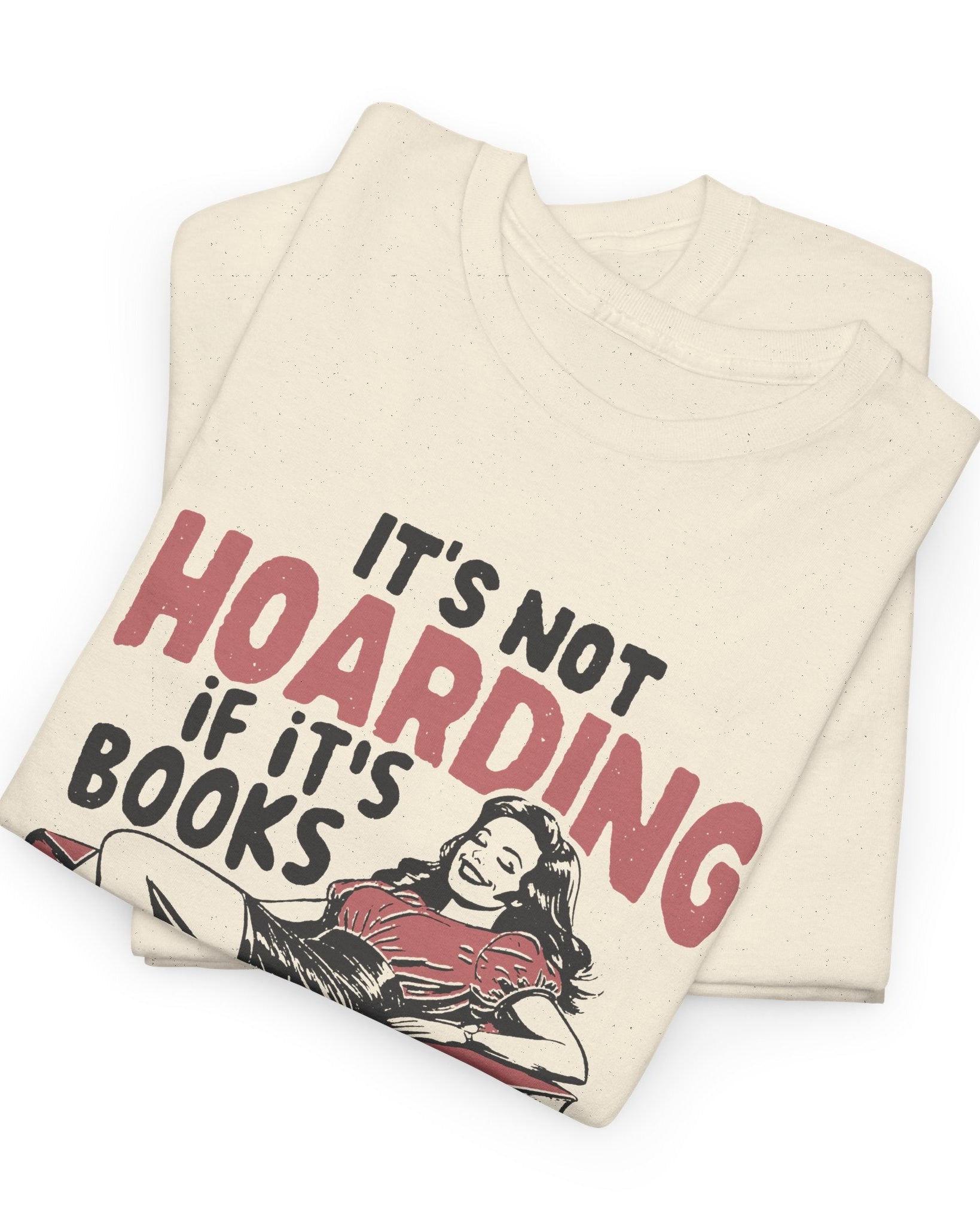 Folded t-shirt with text 'It's not hoarding if it's books' on a white background