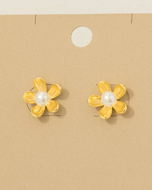 Gold flower-shaped earrings with pearls on a 'Wearbetter' branded card.