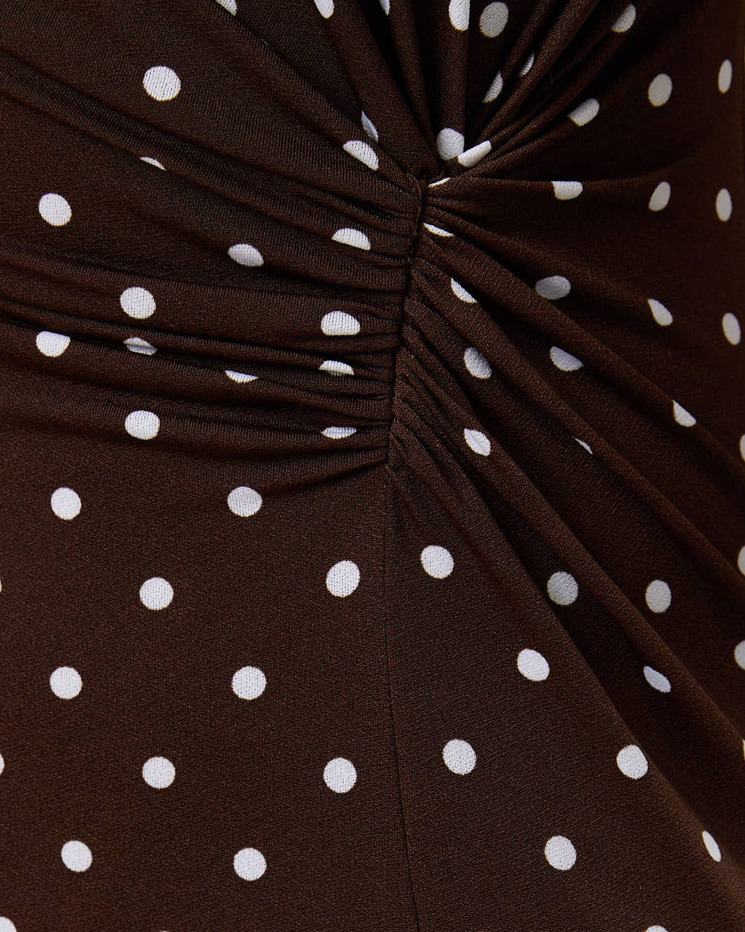 ROUND NECK GATHERED SIDE KNOT POLKA DOT MIDI DRESS. CLOSEUP OF SIDE GATHER.   - Blackbird Boutique