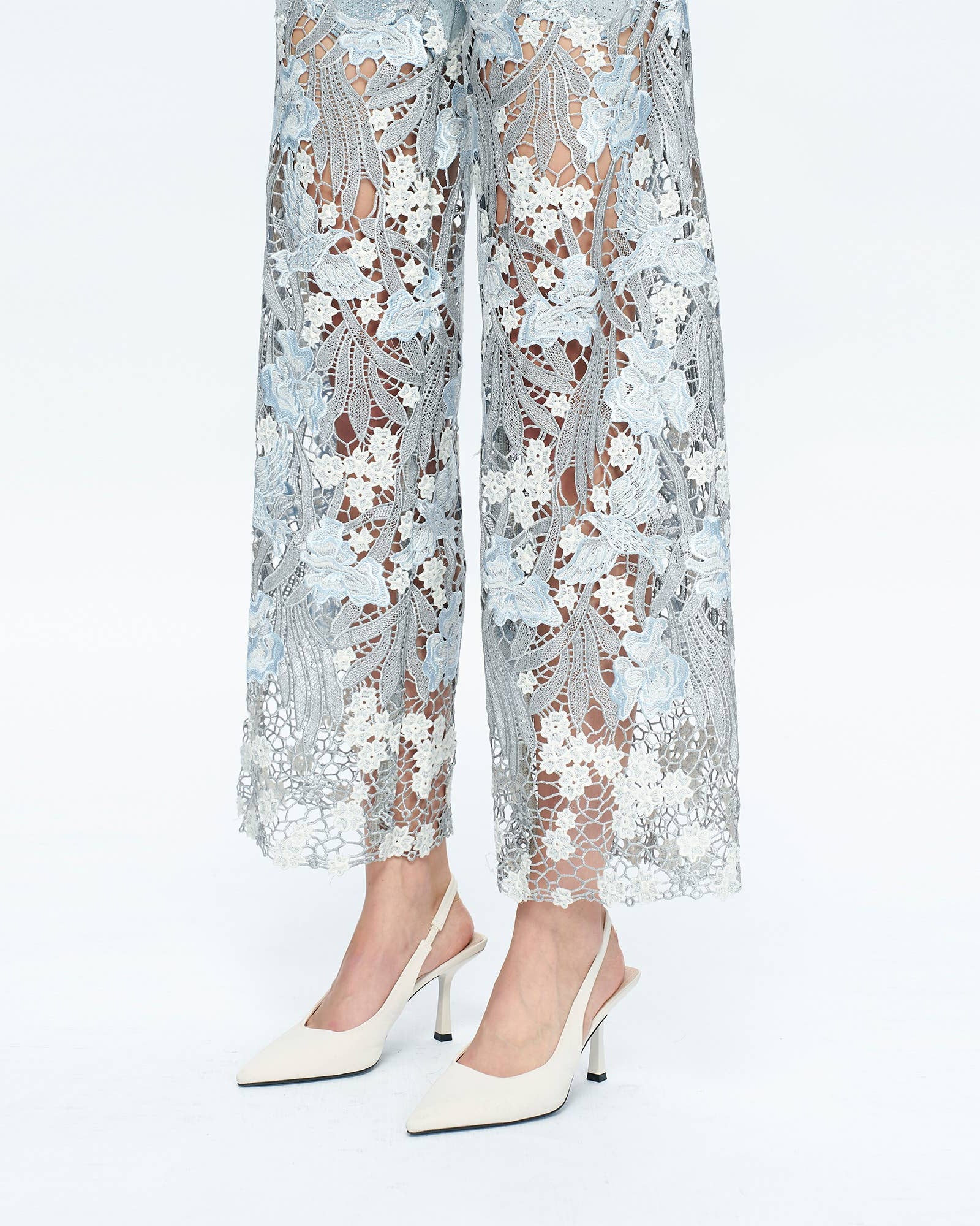 Lace pants with floral patterns on a white background
