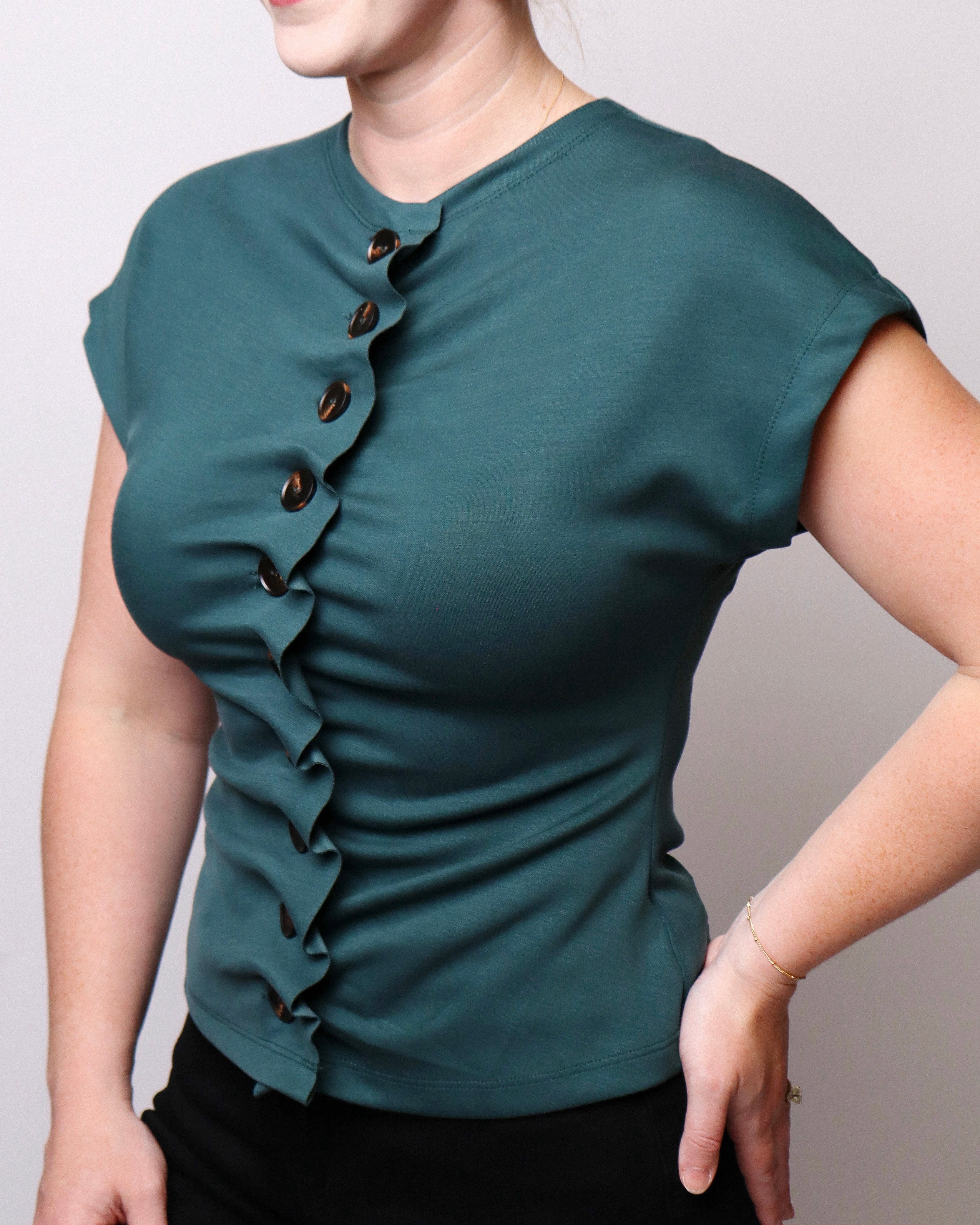 Amber Solid Cap Sleeve Knit Top with Ruched Button Detail in Hunter Green