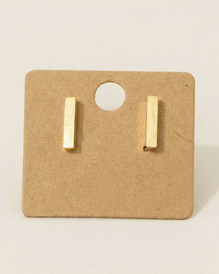 Gold bar earrings on a brown card with '18K Gold Dipped' text