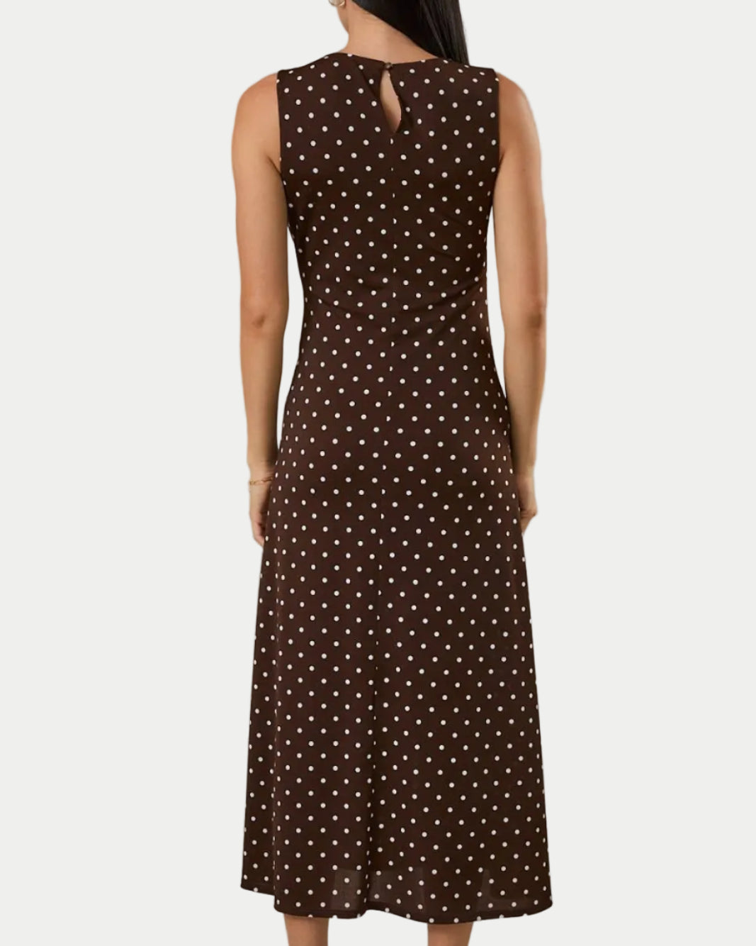 ROUND NECK GATHERED SIDE KNOT POLKA DOT MIDI DRESS BACK SIDE.  ON A MODEL WITH A WHITE BACKGROUND- Blackbird Boutique