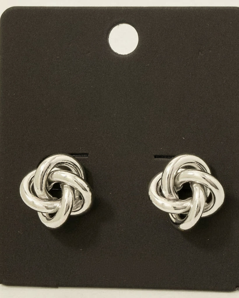 Silver knot earrings on a black card with 'made in Korea' text