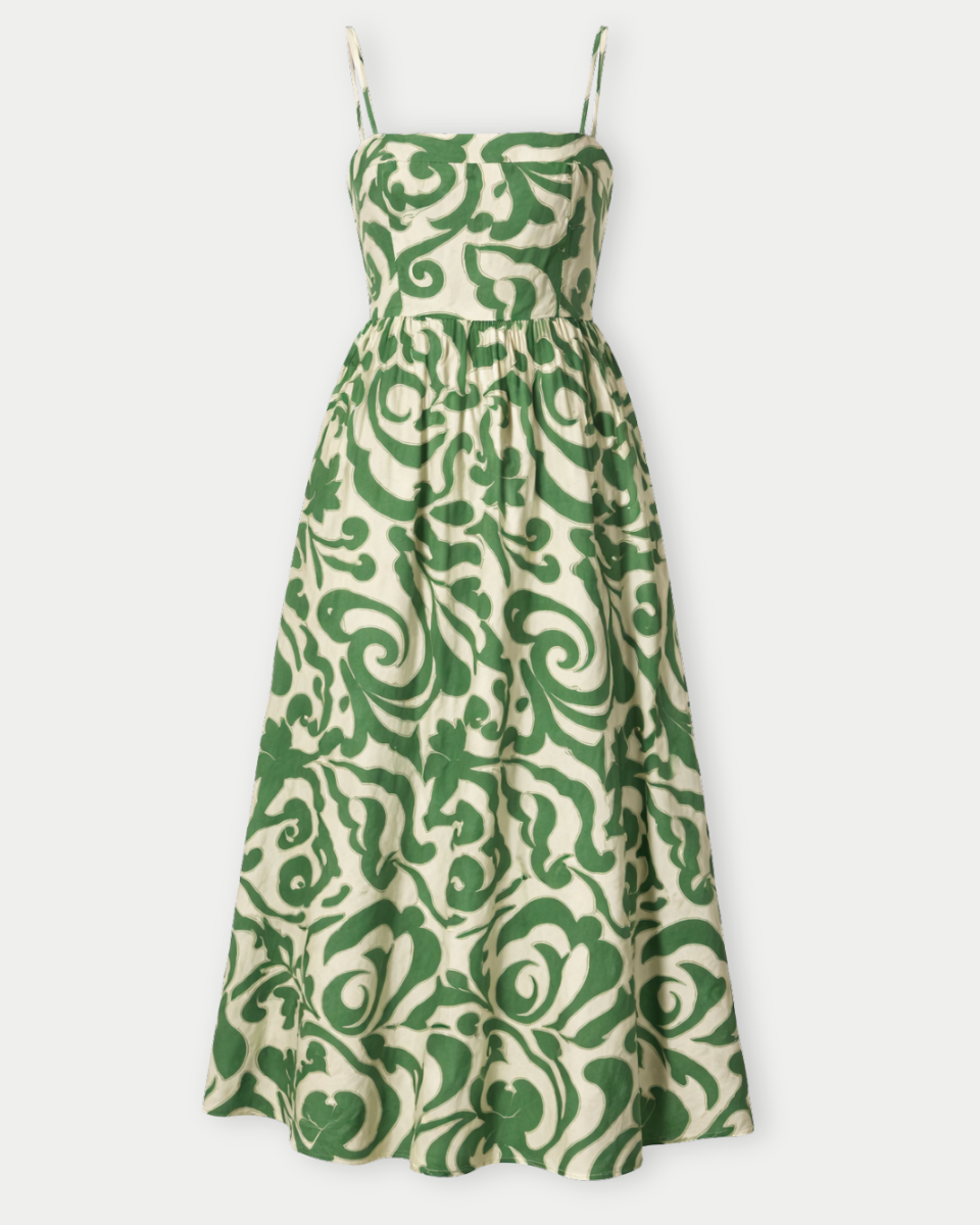 Green and beige patterned dress on a white background