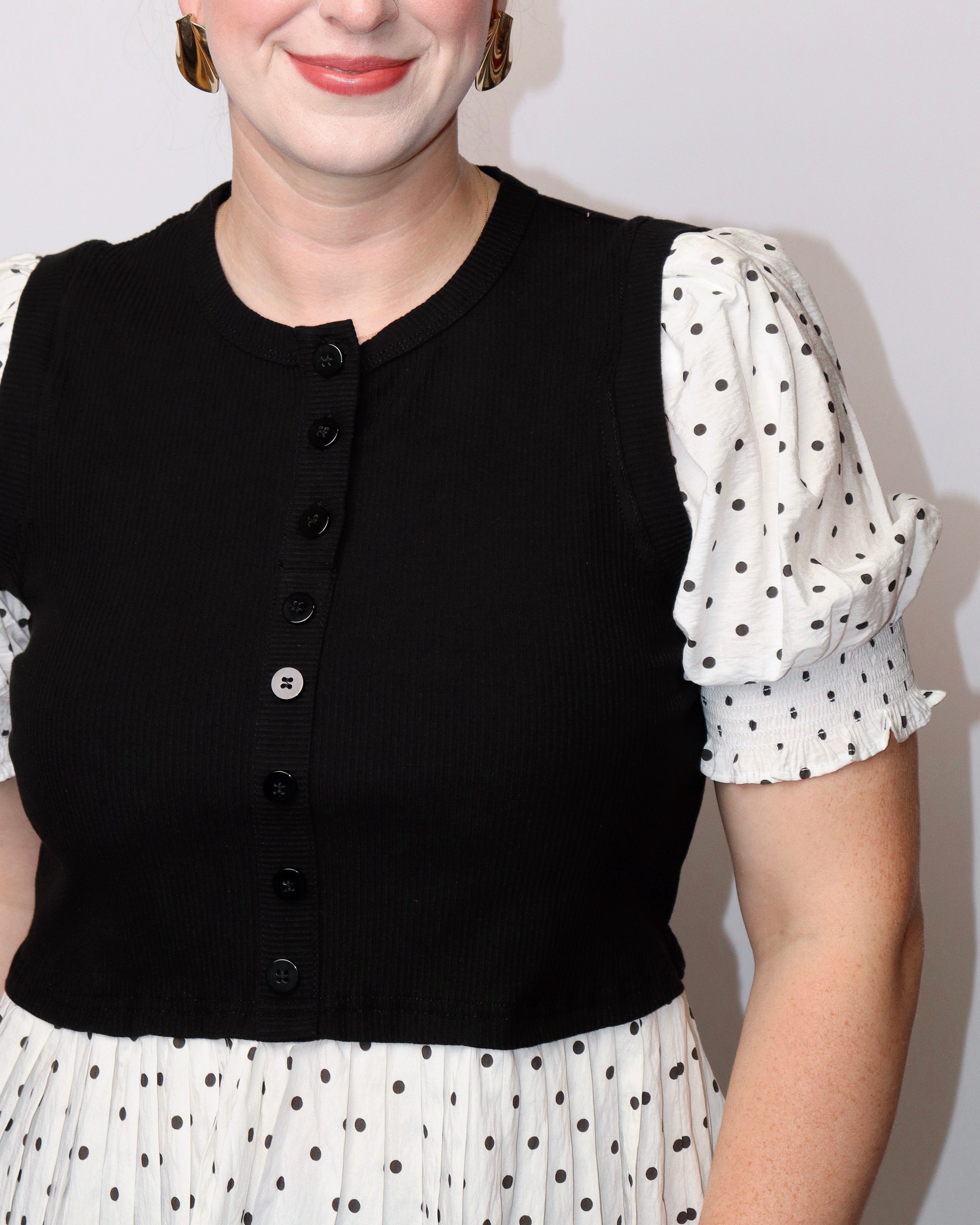 Alice Polka Dot Short Puff Sleeve Top With Rib Knit Bodice in Black front closeup. Blackbird Boutique