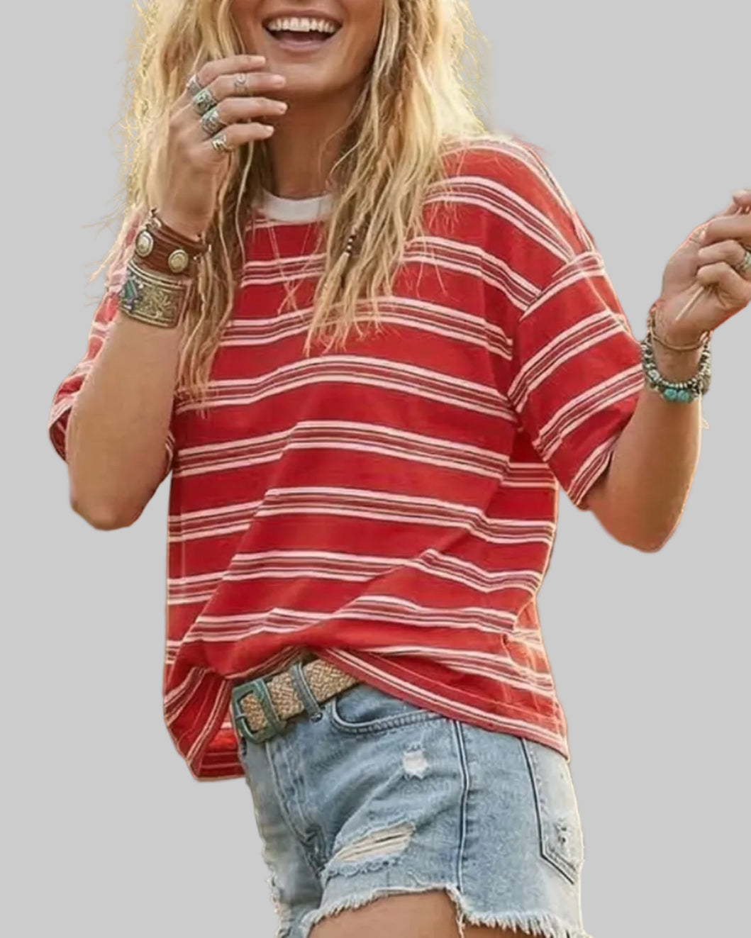 Model wearing a red and white striped shirt on a neutral background