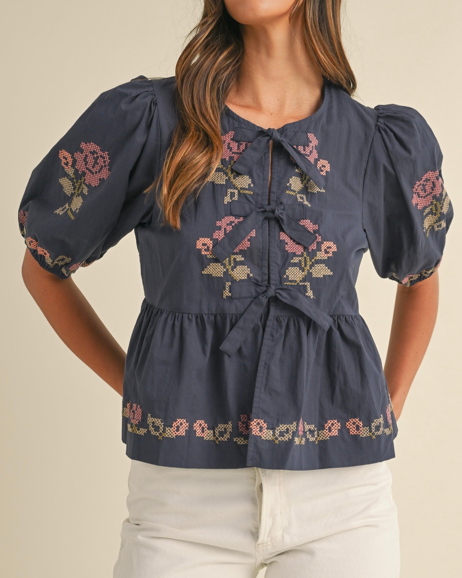 Embroidered Puff Sleeve Bottom Ruffle Front Tie Top in Navy - Blackbird Boutique