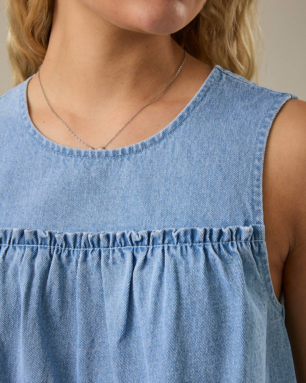 Denim Darling Swing Tank Top on a model with a neutra background- Blackbird Boutique close up