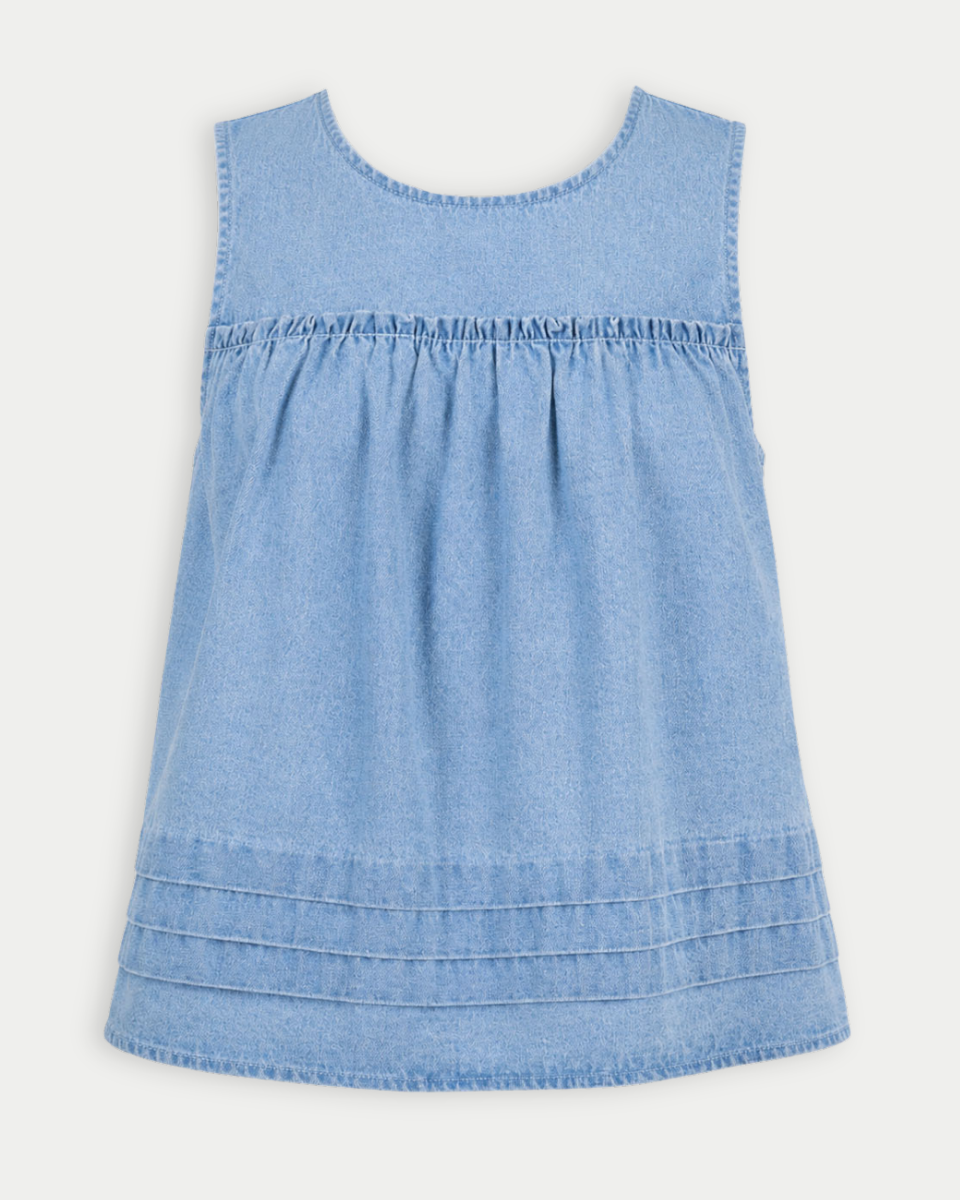 Light blue denim dress on a white background