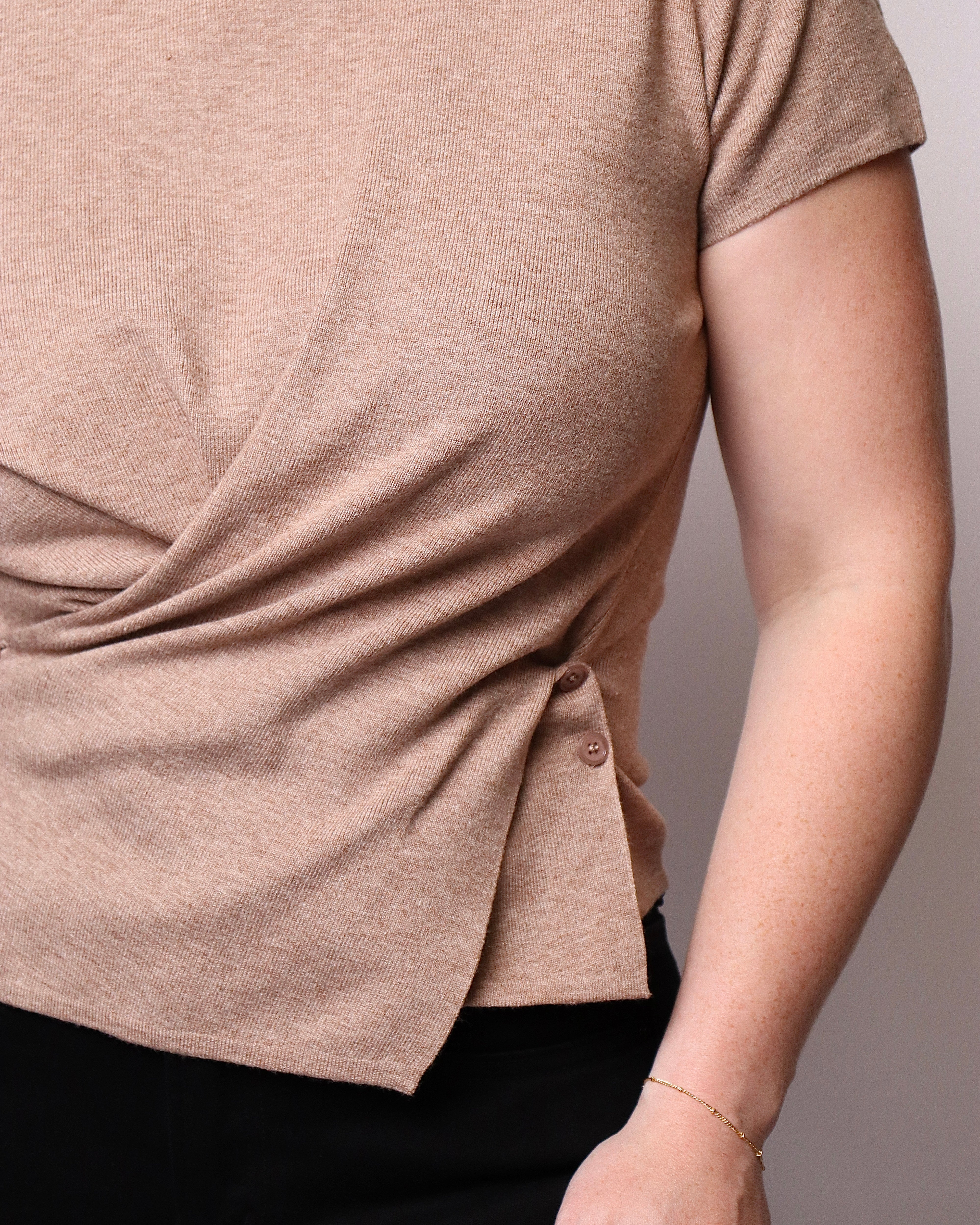 Johnnie Cross Waist Asymmetrical Hem Knit Top