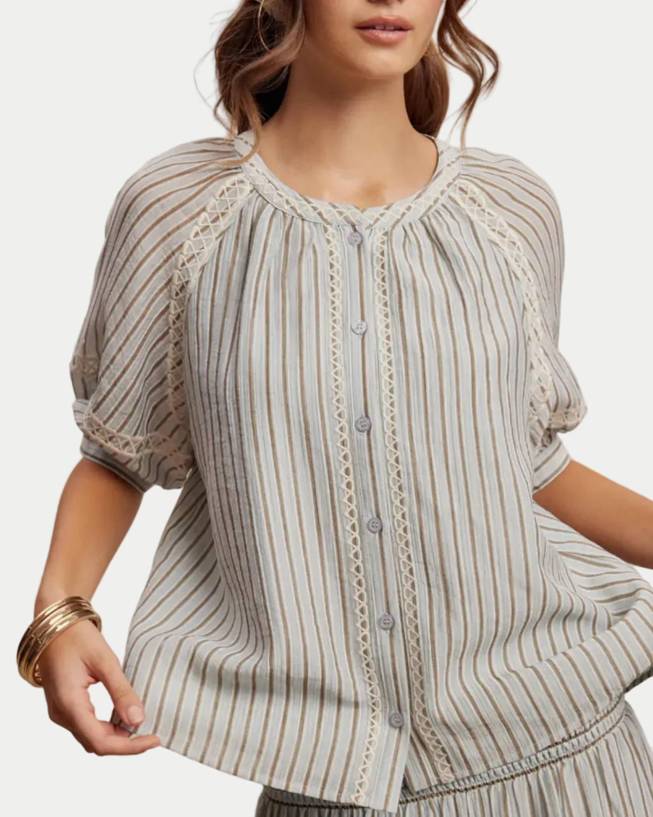 Woman wearing a striped top   on a beige background