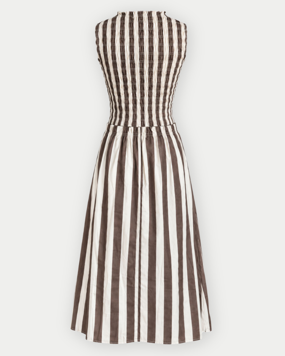 A sleeveless A-line dress with vertical brown and off-white stripes, featuring a fitted bodice and a flared skirt, shown against a plain light gray background.