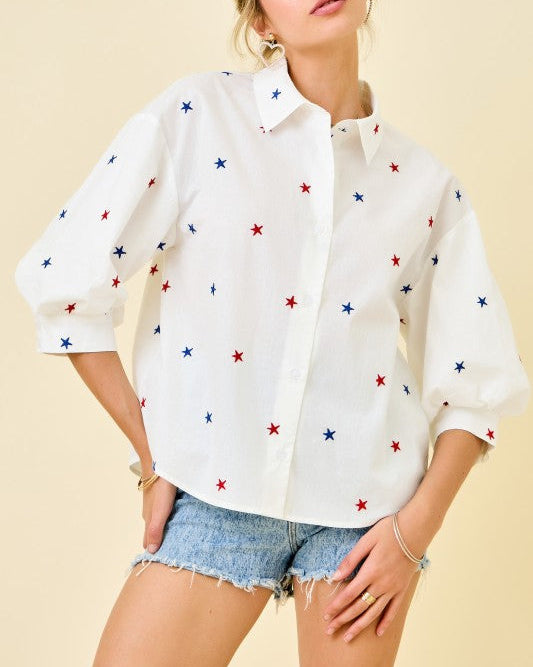 Liberty Star Embroidered Button Down Shirt with Puff Sleeves - Blackbird Boutique White button up Shirt with Blue  and red embroidered starts on a model with a neutral background. Front view