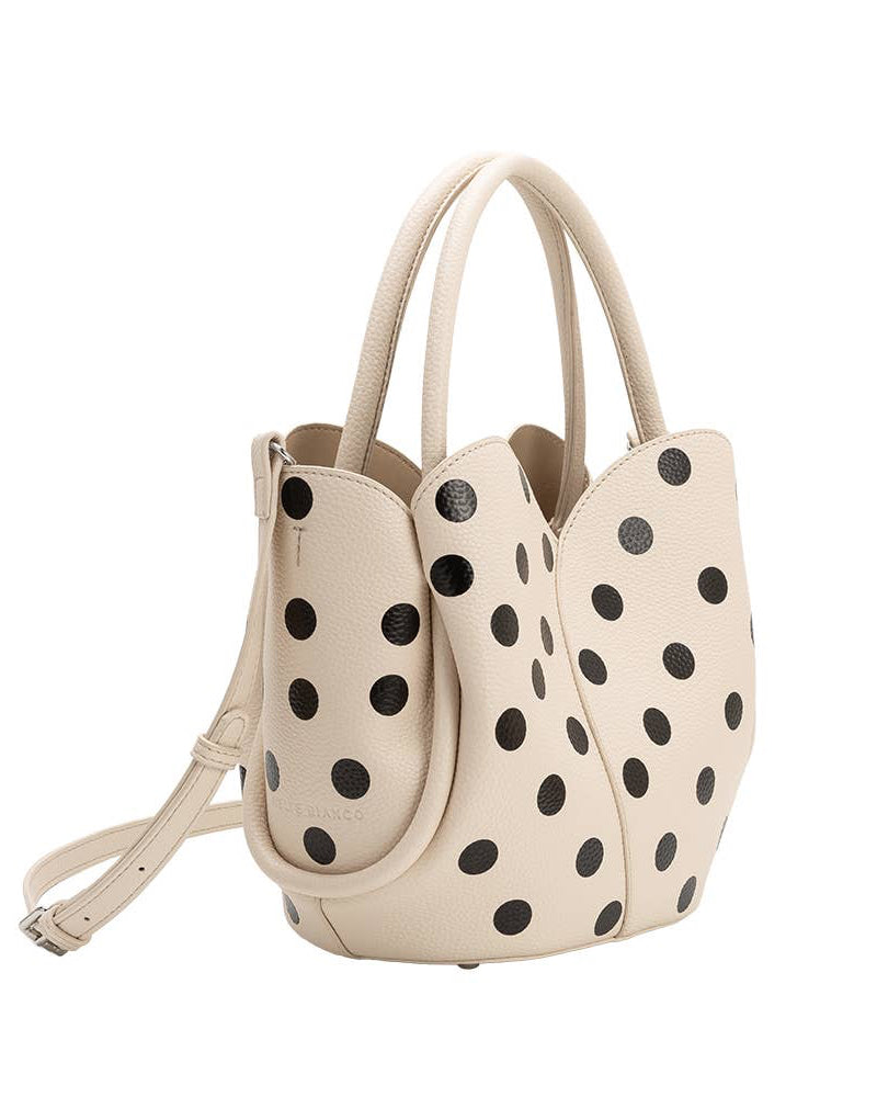 MELIE BIANCO Beige handbag with black polka dots on a white background